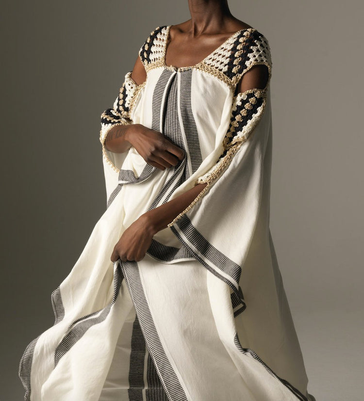 greek designer creating fine knits and crochets to embody feminine elegance, timelessness, and graceful sexiness